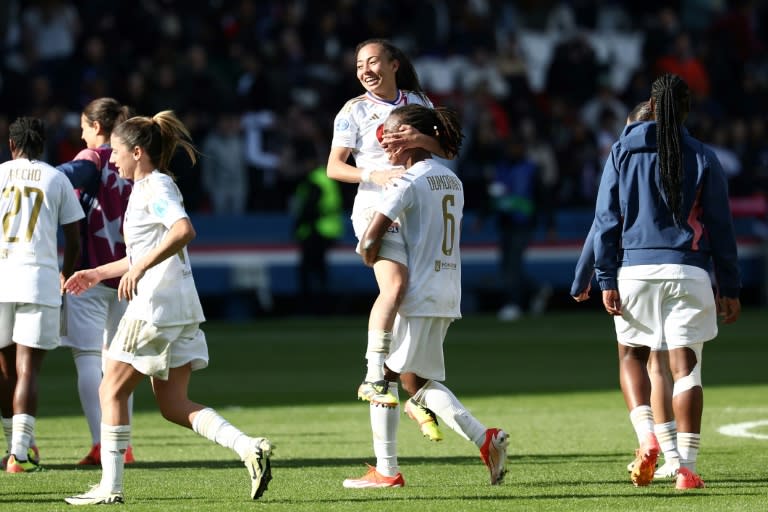 Selma Bacha and Melchie Dumornay, Lyon's two goal-scorers, celebrate together after their team beat French rivals Paris Saint-Germain to reach the Women's Champions League final (FRANCK FIFE)