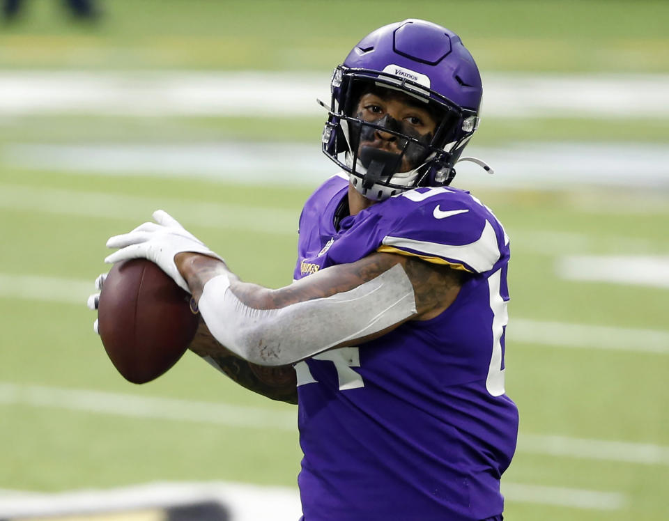 FILE - In this Oct. 18, 2020, file photo, Minnesota Vikings tight end Irv Smith Jr. catches a pass during the first half of an NFL football game against the Atlanta Falcons in Minneapolis. The Vikings have their first significant setback of the season with a knee injury for Smith that requires surgery and will likely sideline him for at least several weeks. (AP Photo/Bruce Kluckhohn, File)