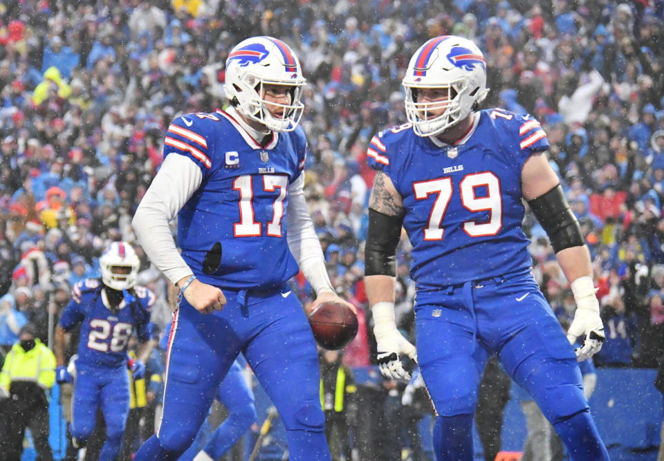 Bills quarterback Josh Allen (17) celebrates scoring a touchdown with offensive tackle <a class="link " href="https://sports.yahoo.com/nfl/players/33481" data-i13n="sec:content-canvas;subsec:anchor_text;elm:context_link" data-ylk="slk:Spencer Brown;sec:content-canvas;subsec:anchor_text;elm:context_link;itc:0">Spencer Brown</a> (79) Credit: Mark Konezny-USA TODAY Sports