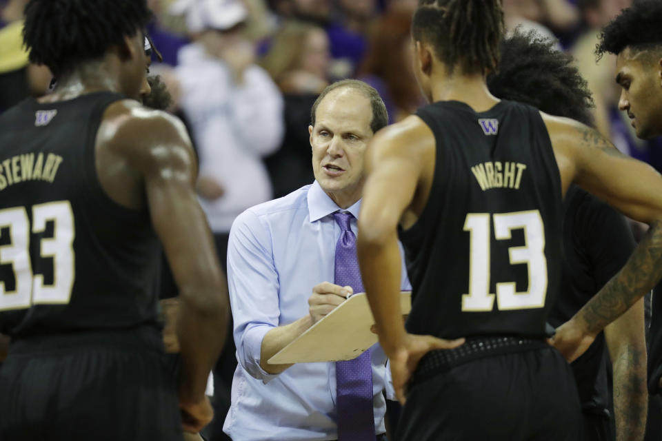 Washington head coach Mike Hopkins talks to his team during a time-out against Oregon in the first half of an NCAA college basketball game, Saturday, Jan. 18, 2020, in Seattle. (AP Photo/Ted S. Warren)