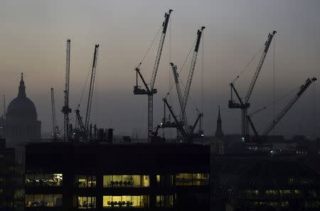 Offices and construction cranes are seen on the skyline in London, Britain, November 2, 2015. REUTERS/Toby Melville/File Photo