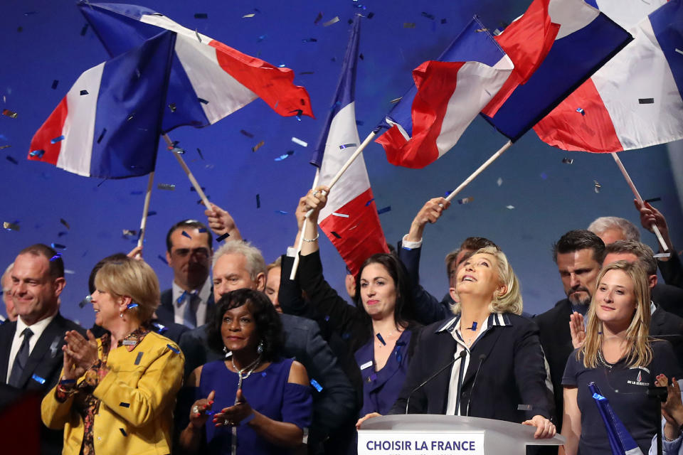 <p>French presidential election candidate for the far-right Front National (FN) party Marine Le Pen (2ndR) is applauded by supporters at the end of a campaign meeting, on April 27, 2017 in Nice. (Valery Hache/AFP/Getty Images) </p>