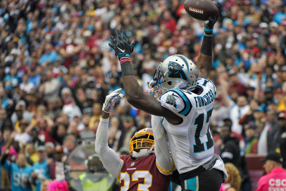 Carolina Panthers wide receiver Devin Funchess (17) pulls in a touchdown pass under pressure from Washington Redskins cornerback Quinton Dunbar (23) during the first half of an NFL football game, Sunday, Oct. 14, 2018, in Landover, Md. (AP Photo/Mark Tenally)