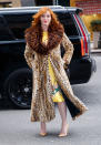 <p>Hendricks makes a statement in a leopard coat with a multicolored fur lapel. (Photo: Getty Images) </p>