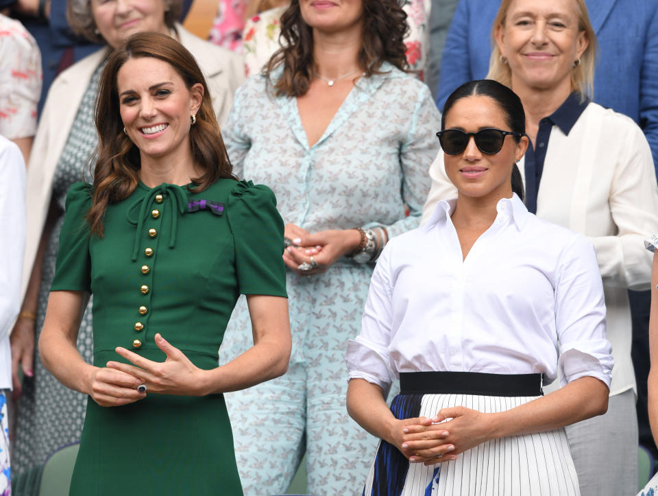 LONDON, ENGLAND - JULY 13: Catherine, Duchess of Cambridge and Meghan, Duchess of Sussex in the Royal Box on Centre Court during day twelve of the Wimbledon Tennis Championships at All England Lawn Tennis and Croquet Club on July 13, 2019 in London, England. (Photo by Karwai Tang/Getty Images)