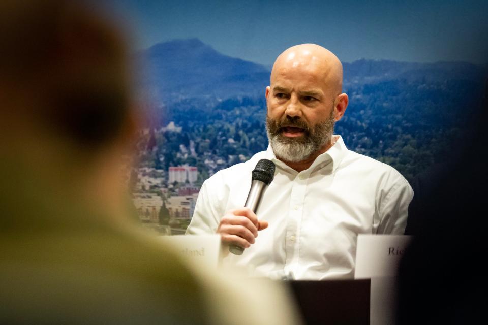 Michael Bratland, a candidate for the Eugene School District 4J school board, speaks April 4 during a forum hosted by the Rotary Club of Eugene.