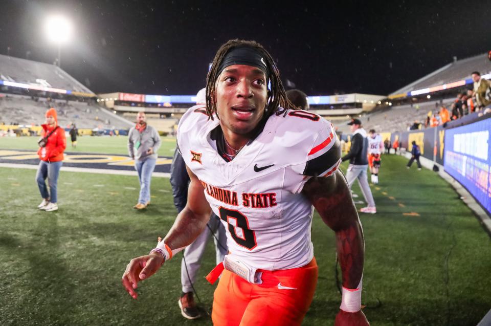 Oct 21, 2023; Morgantown, West Virginia, USA; Oklahoma State Cowboys running back Ollie Gordon II (0) leaves the field after defeating the West Virginia Mountaineers at Mountaineer Field at Milan Puskar Stadium. Mandatory Credit: Ben Queen-USA TODAY Sports