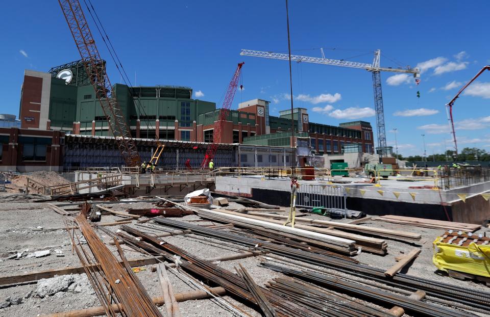 In June 2022, construction crews work to build underground parking and expanded practice facilities at Lambeau Field in Green Bay.