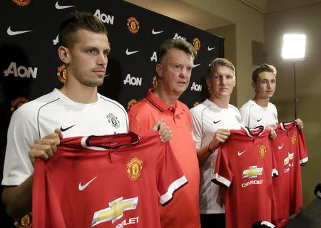 Manchester United's new boys Morgan Schneiderlin, Bastian Schweinsteiger and Matteo Darmian with manager Louis Van Gaal
