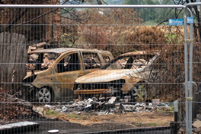 Fire-damaged cars in Wennington