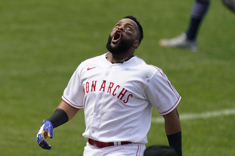 Kansas City Royals' Carlos Santana celebrates after hitting a walk-off home run during the ninth inning of a baseball game against the Detroit Tigers Sunday, May 23, 2021, in Kansas City, Mo. The Royals won 3-2. (AP Photo/Charlie Riedel)