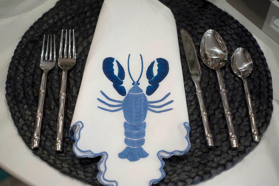 KELLER's stock includes lobster napkins, blue mats and stainless faux bamboo place settings.