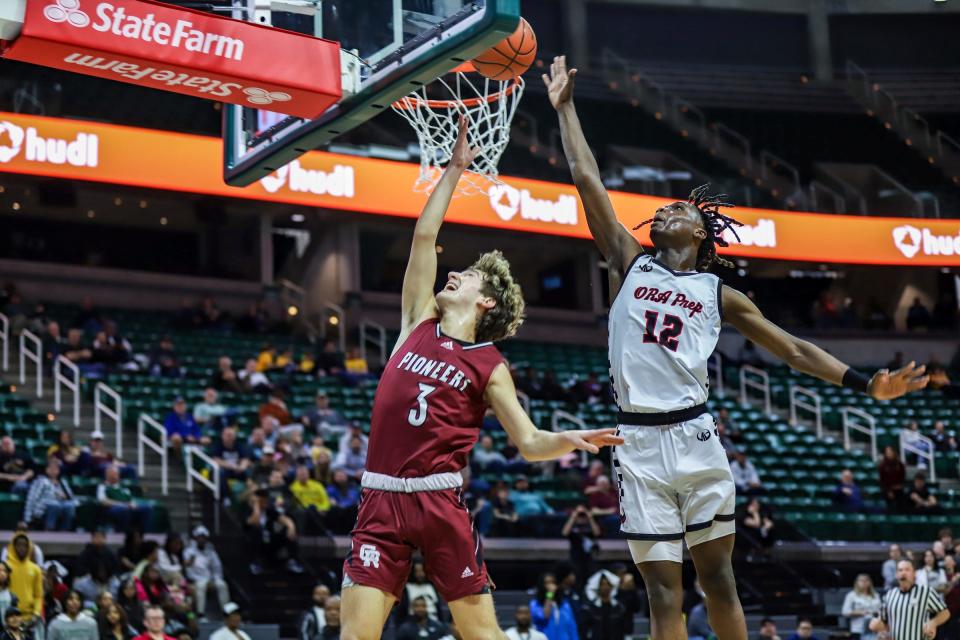 Detroit Old Redford's Justin Austin blocks the shot of Riverview Gabriel Richard’s Luke Westerdale during the first half of the Michigan High School Athletic Association boys basketball Division 3 semifinals at Breslin Center in East Lansing on Thursday, March 14, 2024.