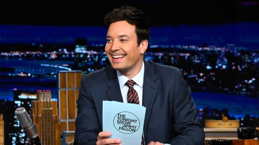  Host Jimmy Fallon sits at his desk on The Tonight Show Starring Jimmy Fallon. 