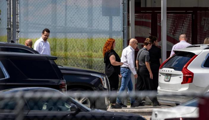 Parkland, Florida - July 5, 2023 - Family members of the shooting victims at Marjory Stoneman Douglas High School visit the scene of the crime escorted by police and other officials. The building will be demolished now that the trials are over.