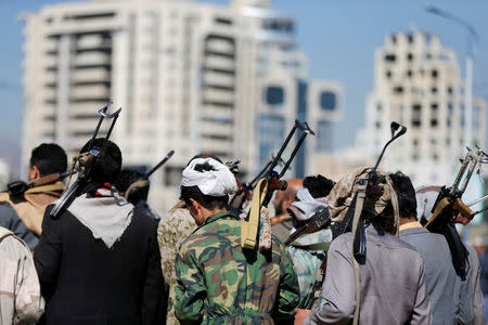 Armed Houthi followers carry their rifles as they attend a gathering to show support for the Houthi movement in Sanaa, Yemen December 19, 2018. REUTERS/Khaled Abdullah