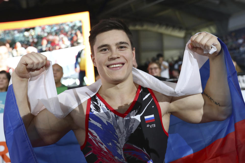 Gold medalist Nikita Nagornyy of Russia celebrates after his performance on the vault in the men's apparatus finals at the Gymnastics World Championships in Stuttgart, Germany, Sunday, Oct. 13, 2019. (AP Photo/Matthias Schrader)