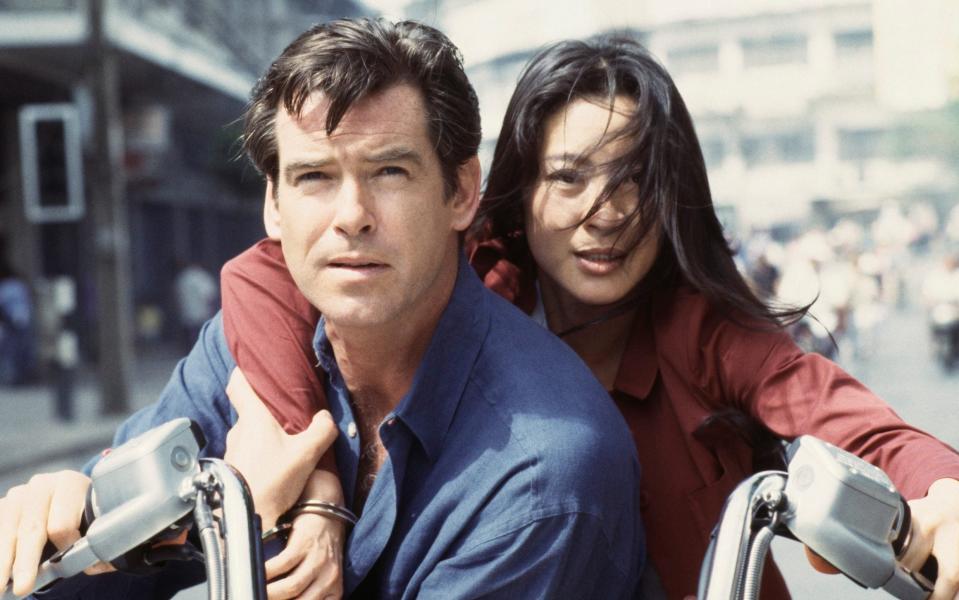 Global action star: Michelle Yeoh with Pierce Brosnan in Bond film Tomorrow Never Dies - Keith Hamshere/Getty Images