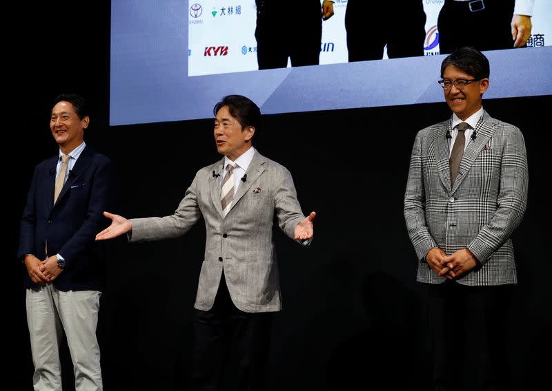 Subaru's CEO Atsushi Osaki, Mazda's CEO Masahiro Moro and Toyota's CEO Koji Sato attend a press conference pledging to each develop a new engine, in Tokyo