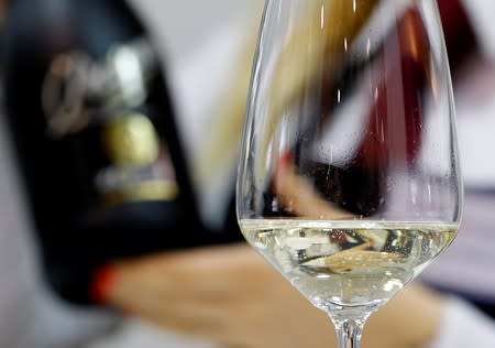 FILE PHOTO: A sommelier pours a glass of Zonin prosecco sparkling wine at the 50th Vinitaly international wine and spirits exhibition in Verona