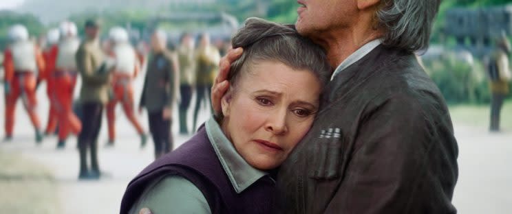 <p>Fans were delighted to see Fisher back as Leia — General Leia Organa, this time — alongside Harrison Ford in <em>Star Wars: The Force Awakens</em> in 2015. (Photo: Everett Collection)</p>