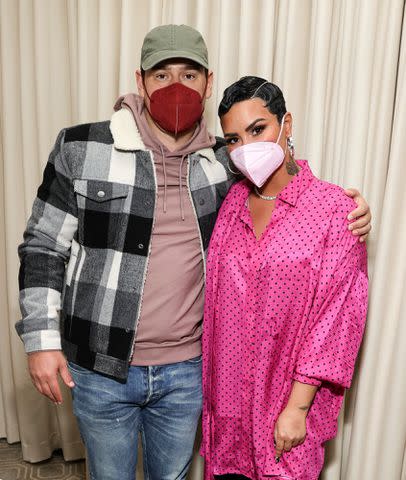 <p>Rich Fury/Getty Images for OBB Media</p> Scooter Braun and Demi Lovato in Beverly Hills in March 2021