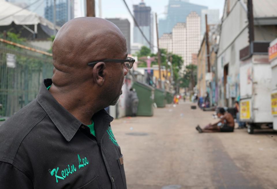 Kevin Lee, director of operations at Urban Alchemy, checks the alley near the ARCH. The city of Austin pays the nonprofit to run some of its homeless shelters and provide other services.