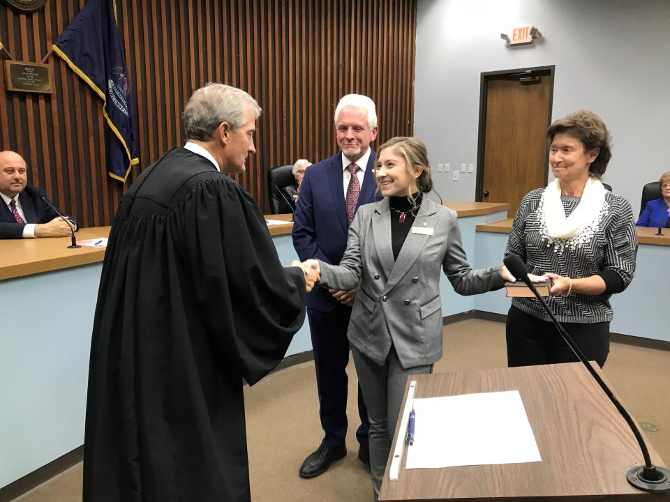 From left, Michigan Supreme Court Justice Brian Zahra congratulates newly sworn-in Southgate City Council President Zoey Kuspa on Nov. 16 at Southgate City Hall, while looking on are her father Mayor Joseph Kuspa and her mother Kim Kuspa. At far left, City Councilman Bill Kolovos watches.