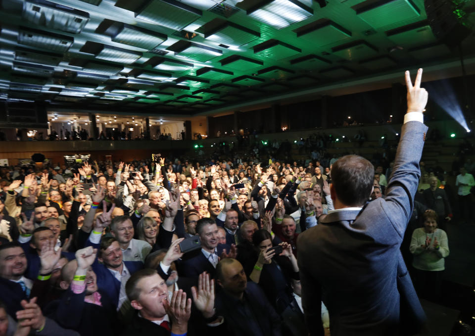 Leader of the Ordinary People and Independent Personalities party Igor Matovic strikes a V-sign after acknowledging preliminary results of the general election in Trnava, Slovakia, Sunday, March 1, 2020. (AP Photo/Petr David Josek)