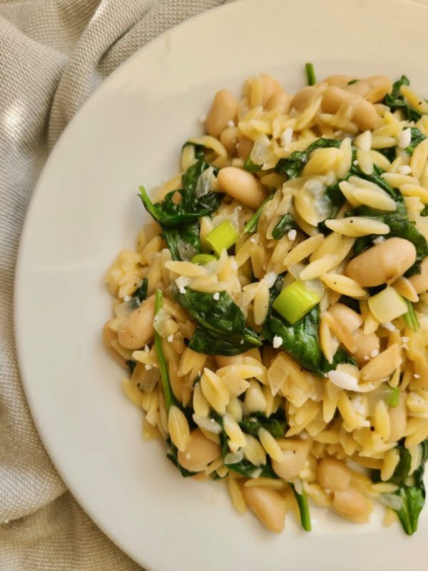 <p>Ugly Vegan Kitchen</p><p>This frugal, easy vegan orzo cannellini beans recipe cooks up quick, and is packed with savory flavors. You can’t beat an orzo recipe with spinach! It works well as a side dish or as main entree.</p><p><strong>Get the recipe: <a href="https://uglyvegankitchen.com/2018/05/02/spinach-cannellini-bean-orzo/" rel="nofollow noopener" target="_blank" data-ylk="slk:Spinach Cannellini Bean Orzo;elm:context_link;itc:0;sec:content-canvas" class="link rapid-noclick-resp"><em>Spinach Cannellini Bean Orzo</em></a></strong></p>