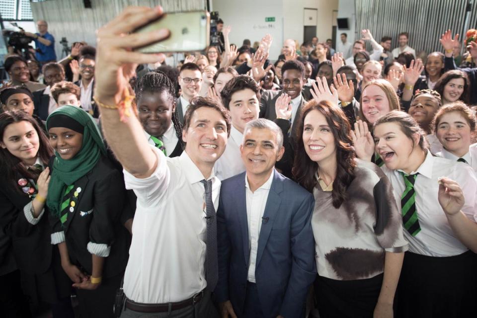 Canadian Prime Minister Justin Trudeau takes a selfie with Mayor of London Sadiq Khan and New Zealand Prime Minister Jacinda Ardern at City Hall in London, during the Commonwealth Heads of Government Meeting on 18 April 2018 (PA)