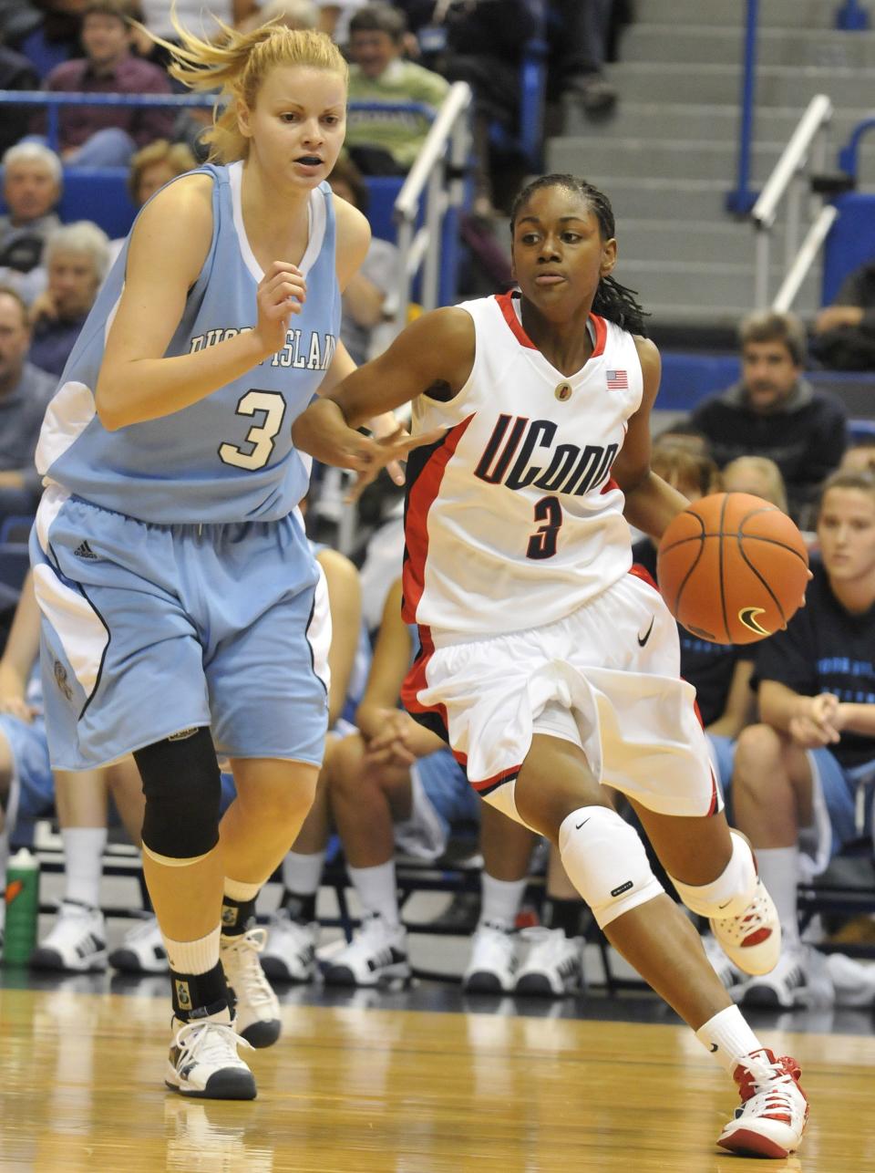 Connecticut's Tiffany Hayes right, drives past by Rhode Island's Tanja Licina, right, during the first half of an NCAA college women's basketball game in Hartford, Conn., Saturday, Nov. 22, 2008. (AP Photo/Jessica Hill)