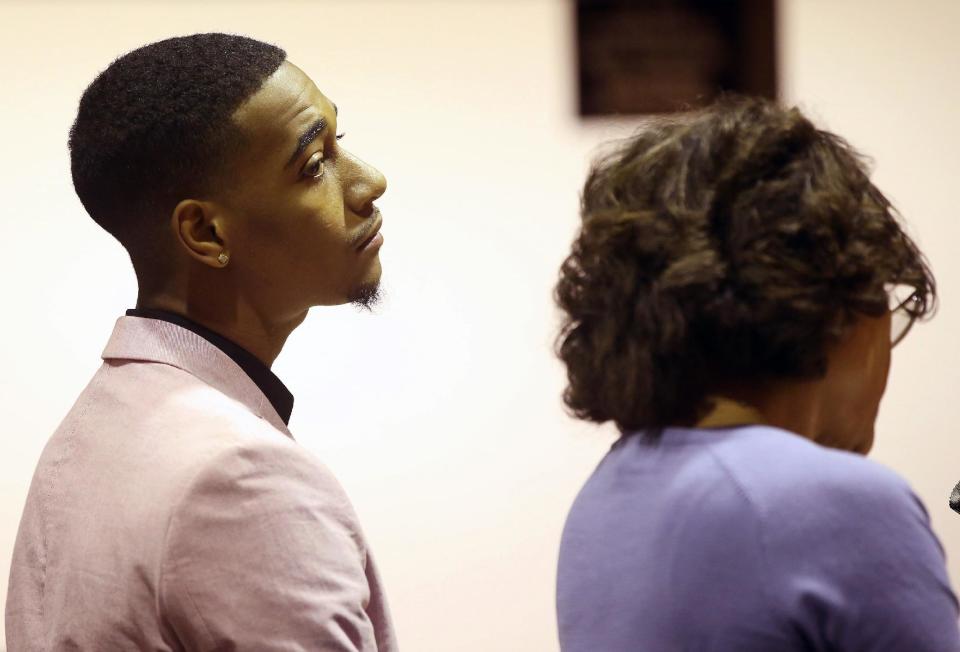 Rapper Lil Za, left, stands with his Attorney, Shawn Holley, during during his arraignment in Los Angeles Superior Court on Wednesday, April 30, 2014. Lil Za, who's real name Xavier Smith, pleaded no contest to felony possession of ecstasy, and was sentenced to three years of probation and a drug treatment program in a case that was filed after he was arrested during a search of Justin Bieber’s mansion in January 2014. (AP Photo/Nick Ut)