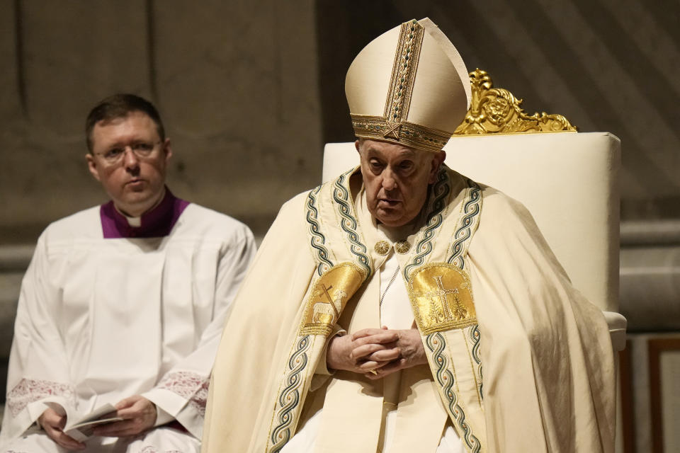 Pope Francis presides over the Easter vigil celebration in St. Peter's Basilica at the Vatican, Saturday, March 30, 2024. (AP Photo/Alessandra Tarantino)