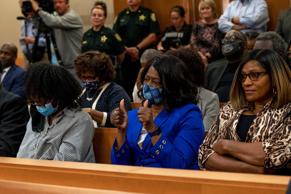 Family members of the Groveland Four, Charles Greenlee, Walter Irvin, Samuel Shepherd and Ernest Thomas, listen as Circuit Court Judge Heidi Davis dismisses the case Nov. 22, 2021.  [Cindy Peterson/Correspondent]