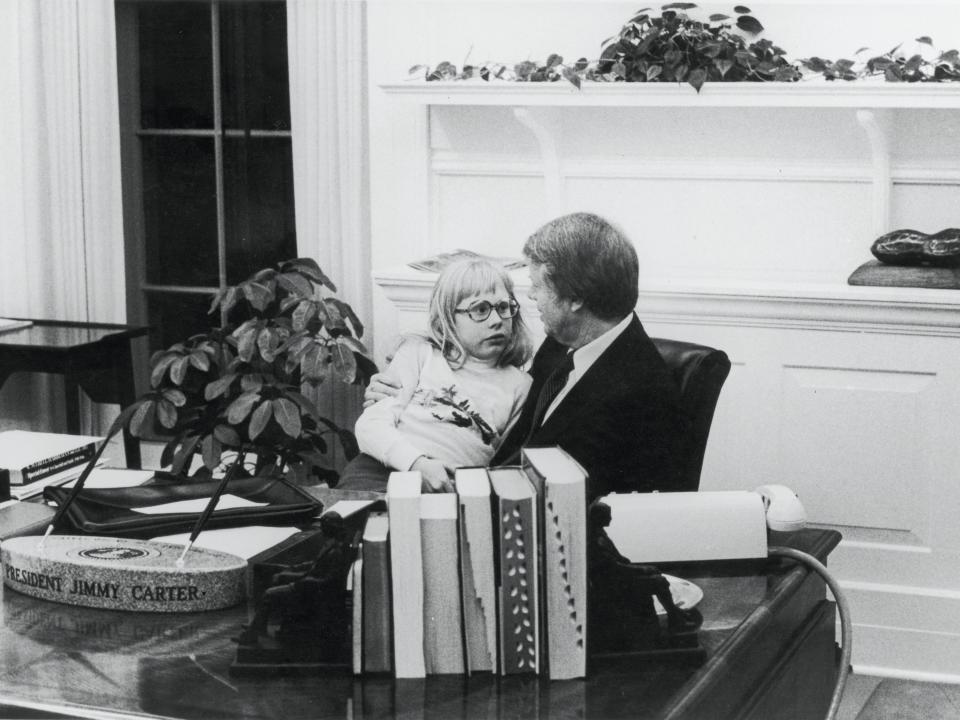 Jimmy Carter with his daughter Amy in the Oval Office, 1978.
