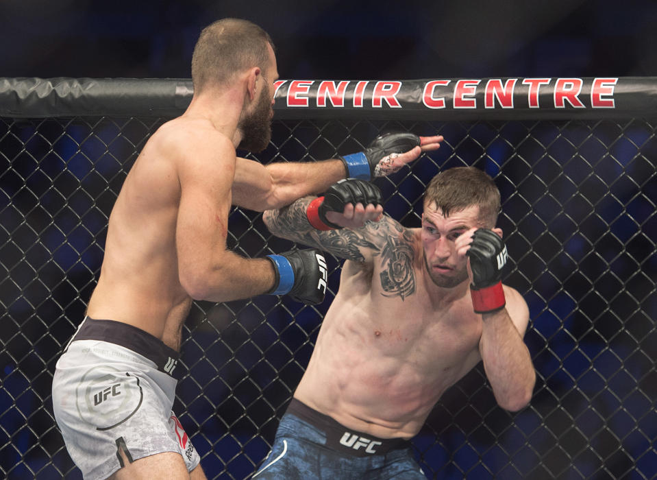 FILE- Stevie Ray, right, of Scotland, battles Jessin Ayari, of Germany, in a lightweight mixed martial arts bout during UFC Fight Night at the Avenir Centre in Moncton, New Brunswick, on Oct. 27, 2018. Ray is slated to fight Anthony Pettis in the Professional Fighters League playoffs Friday night, Aug. 5, 2022, at the Hulu Theater at Madison Square Garden in New York. (Andrew Vaughan/The Canadian Press via AP, File)