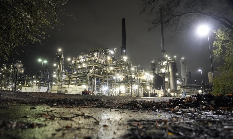 FILE - A refinery is illuminated in Gelsenkirchen, Germany, Tuesday evening, April 5, 2022. European governments were poised to ban on Russian coal imports despite the near-certainty of higher utility bills and inflation. But the limited energy sanction only underlined inability to agree on a much more sweeping ban on oil and gas that would hit Russia much harder but risk inflation and recession at home. (AP Photo/Martin Meissner, File)