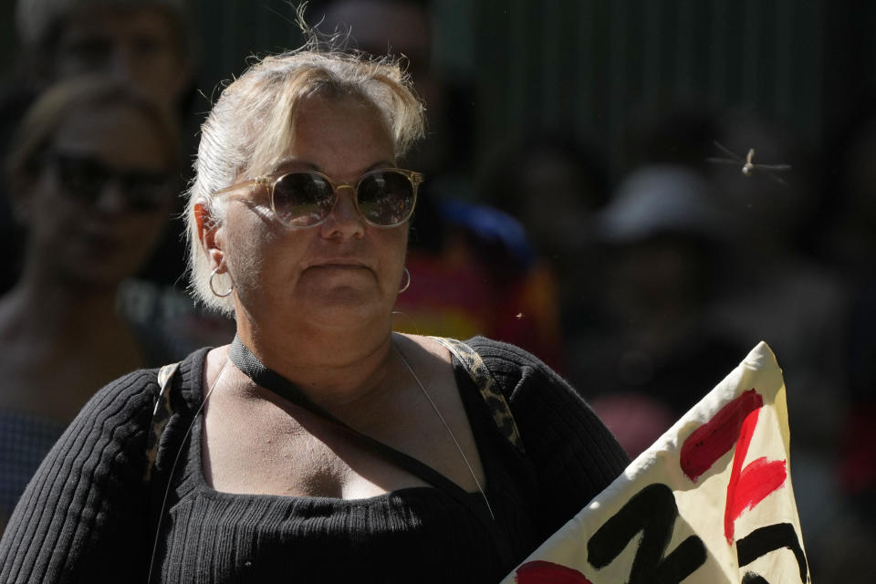 A dragonfly buzzes past a woman attending an Invasion Day rally in Sydney, Thursday, Jan. 26, 2023. Australia is marking the anniversary of British colonists settling modern day Sydney in 1788 while Indigenous protesters deride Australia Day as Invasion Day. (AP Photo/Rick Rycroft)