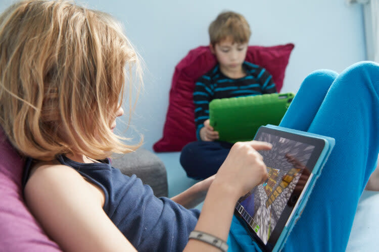 Two 9-year-olds play the open world computer game Minecraft. Parenting expert Devorah Heitner urges parents to know more about what their kids are doing online without resorting to surveillance. (Getty Images)