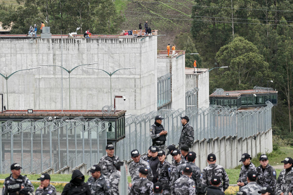 Police forces stand guard outside the Turi prison as inmates hold prison guards hostage, in Cuenca, Ecuador, on January 8, 2024. Following the escape of the head of the Los Choneros drug gang, incidents were reported in several of the country's prisons. / Credit: FERNANDO MACHADO/AFP via Getty Images