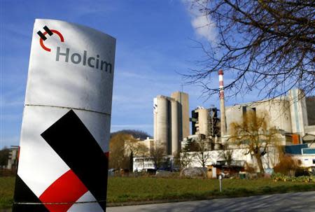 A Holcim logo is pictured in front of the cement works in Eclepens near Lausanne February 25, 2014. REUTERS/Denis Balibouse