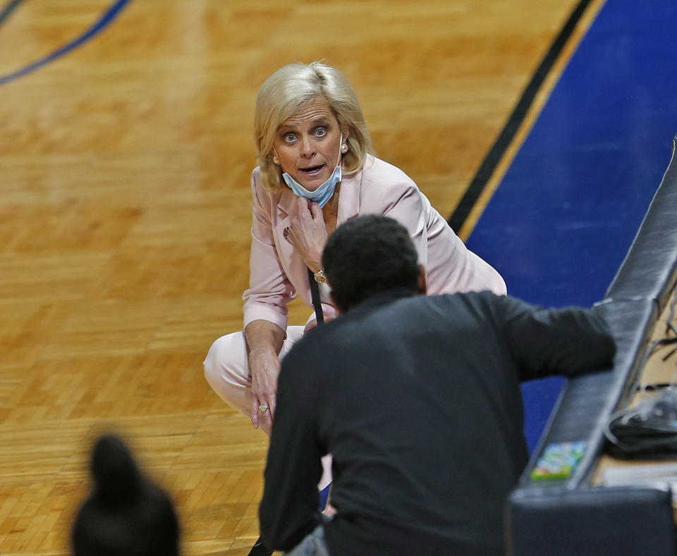 Baylor head coach Kim Mulkey has words with Virginia Tech head coach Kenny Brooks during the first half of a college basketball game in the second round of the women's NCAA tournament at the Greehey Arena in San Antonio, Tuesday, March 23, 2021. (AP Photo/Ronald Cortes)