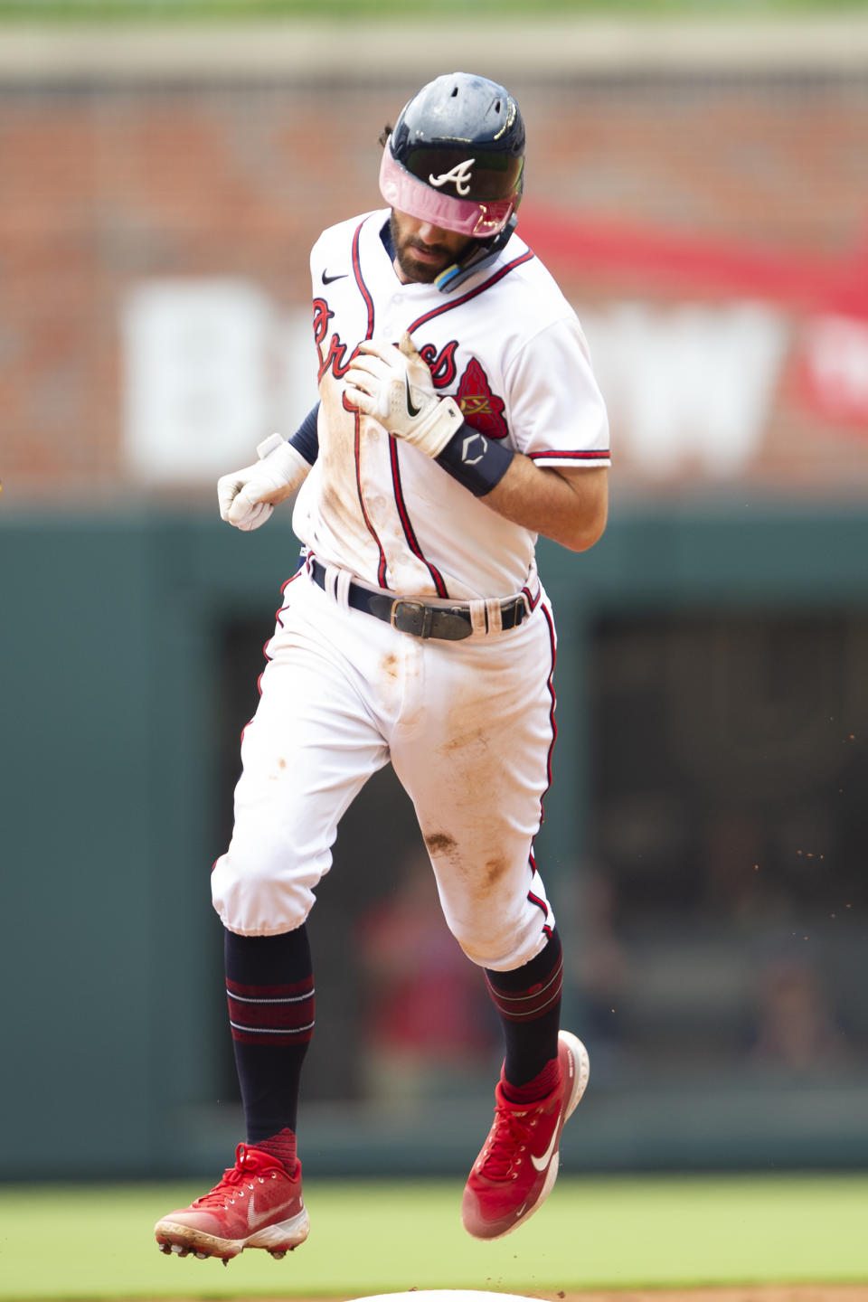 Atlanta Braves Dansby Swanson (7) rounds second base after a two score homer during the fourth inning of a baseball game against the San Diego Padres Sunday, May 15, 2022, in Atlanta. (AP Photo/Hakim Wright Sr)