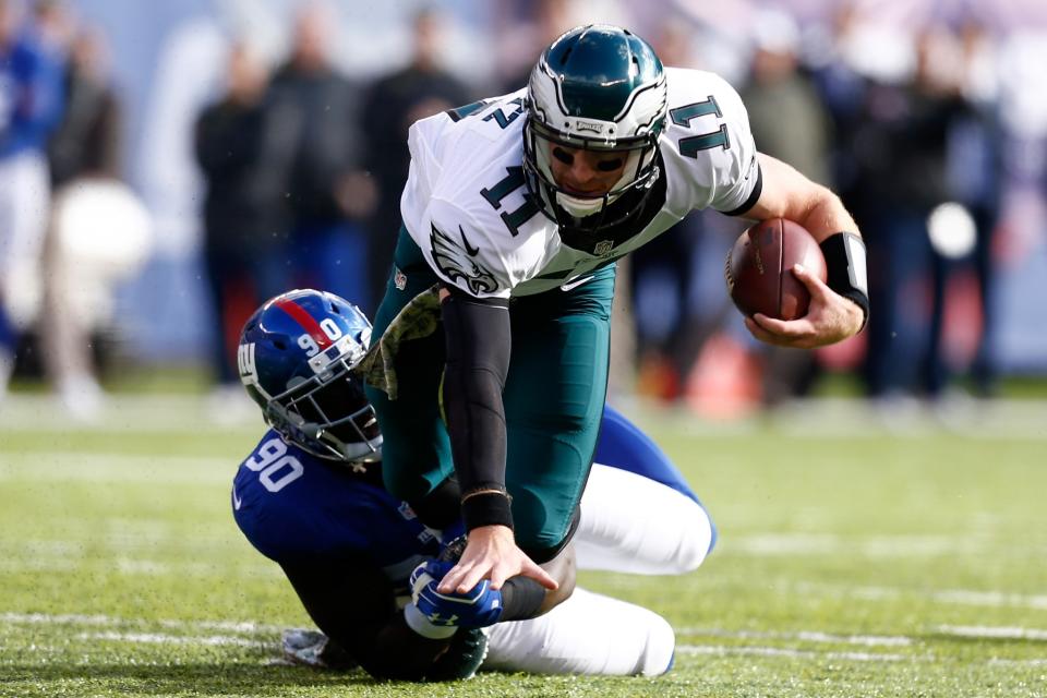 <p>Jason Pierre-Paul #90 of the New York Giants tackles Carson Wentz #11 of the Philadelphia Eagles during the first quarter of the game at MetLife Stadium on November 6, 2016 in East Rutherford, New Jersey. (Photo by Jeff Zelevansky/Getty Images) </p>