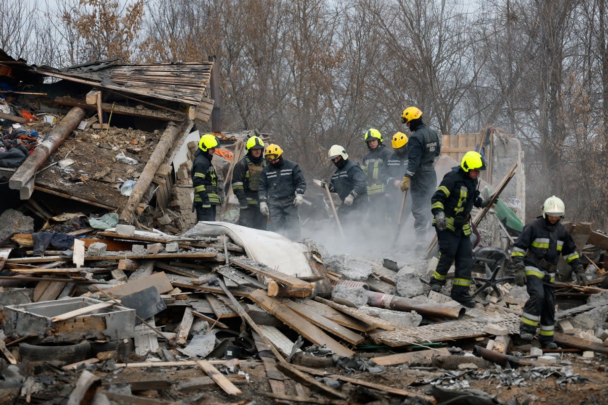 Rescuers work at a site damaged during a Russian missile strike in Kyiv  (REUTERS)
