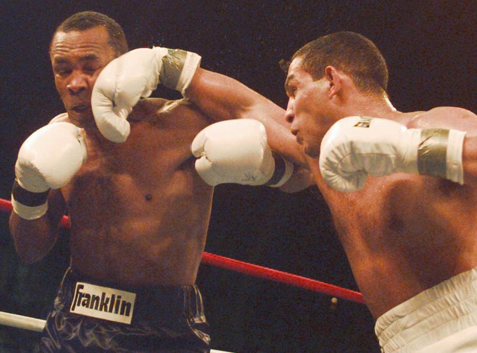 Hector Camacho of Puerto Rico , right, lands a punch on the chin of Sugar Ray Leonard during the second round of their IBC Middleweight Title fight Saturday, March 1, 1997 in Atlantic City, N. J. Camacho won by a Technical Knockout in the fifth round.(AP Photo/Charles Rex Arbogast)