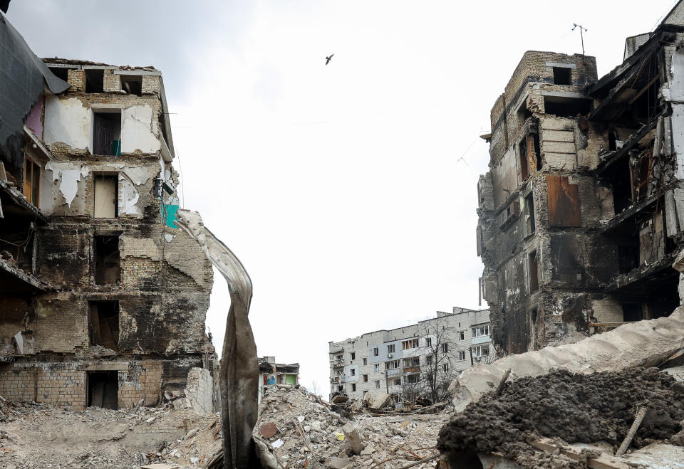 A bird flies over the rubble of a building destroyed by Russian shelling, amid Russia's Invasion of Ukraine, in Borodyanka, Kyiv region, Ukraine, April 11, 2022. (Photo by Sergii Kharchenko/NurPhoto via Getty Images)