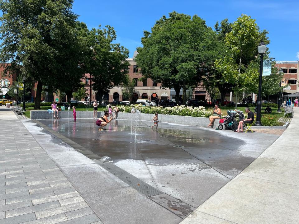 Kids play in the fountains at City Hall Park on July 20, 2023. The "splash pad" was part of the park's renovations in 2020.