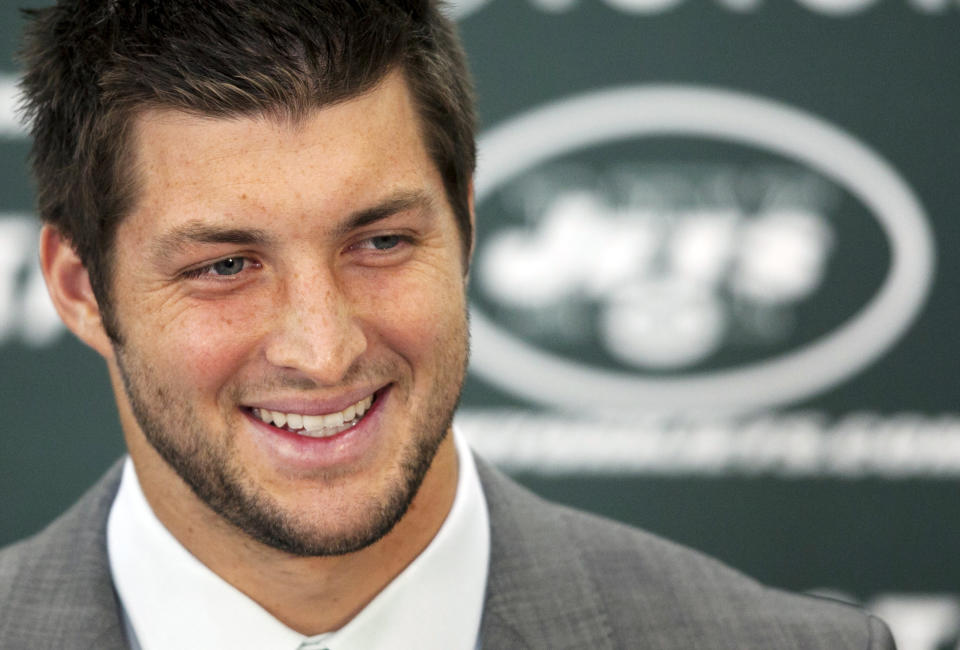 Tim Tebow holds his first news conference with the New York Jets, Monday, March 26, 2012, in Florham Park, N.J. Tebow, who led the Denver Broncos to the playoffs last year, was acquired in a trade Wednesday with Denver and will serve as the backup quarterback to Mark Sanchez. (AP Photo/Mark Lennihan)